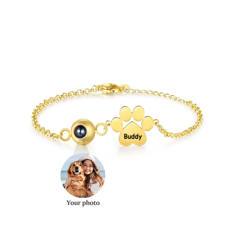 Gold photo projection bracelet with custom pet picture inside bead and engraved paw charm