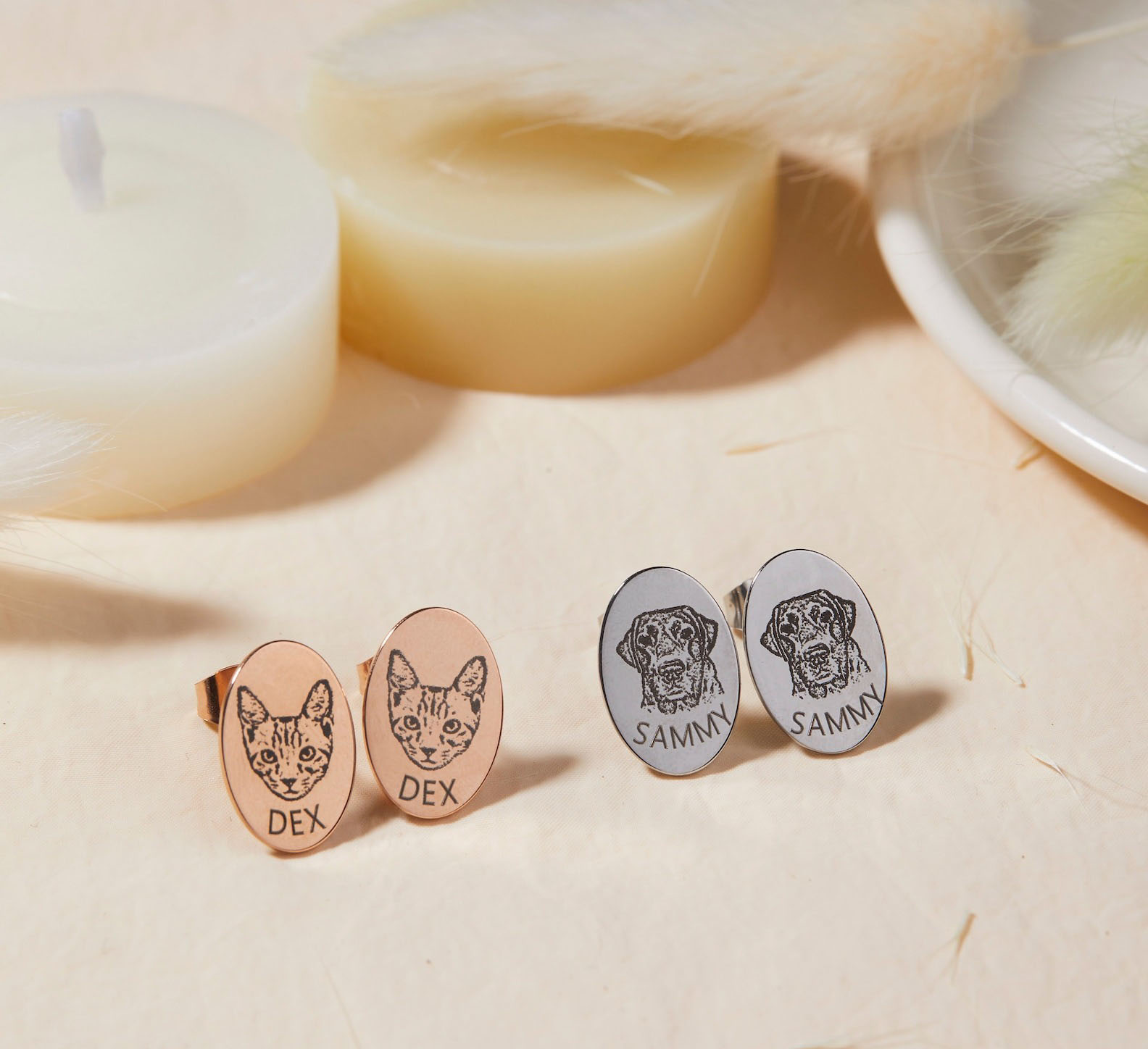 Rose gold personalized pet portrait stud earrings flat lay on cream background