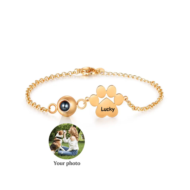 Close-up of projection bead showing pet photo and engraved paw name plate, custom picture bracelet