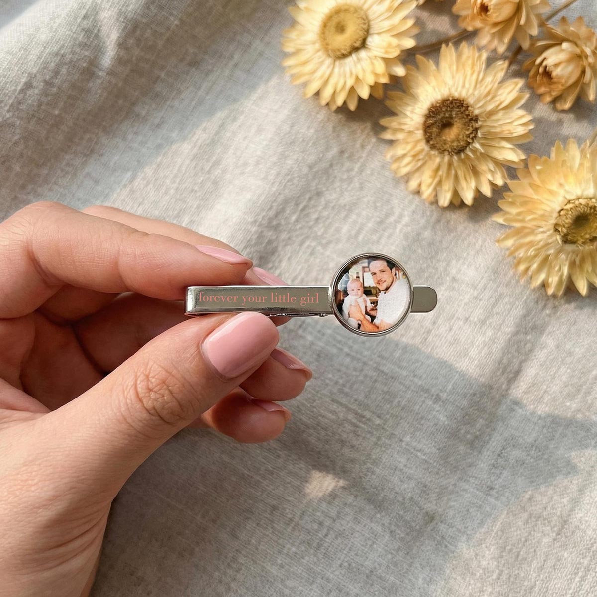 Close up of custom engraved text on personalized photo tie clip tie bar