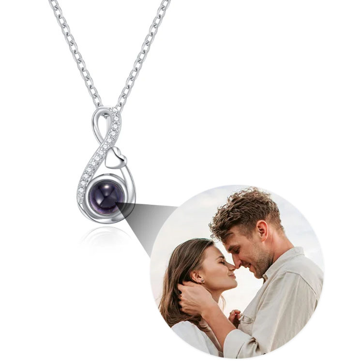 Silver personalized infinity photo projection necklace with projected couple picture inside hidden pendant