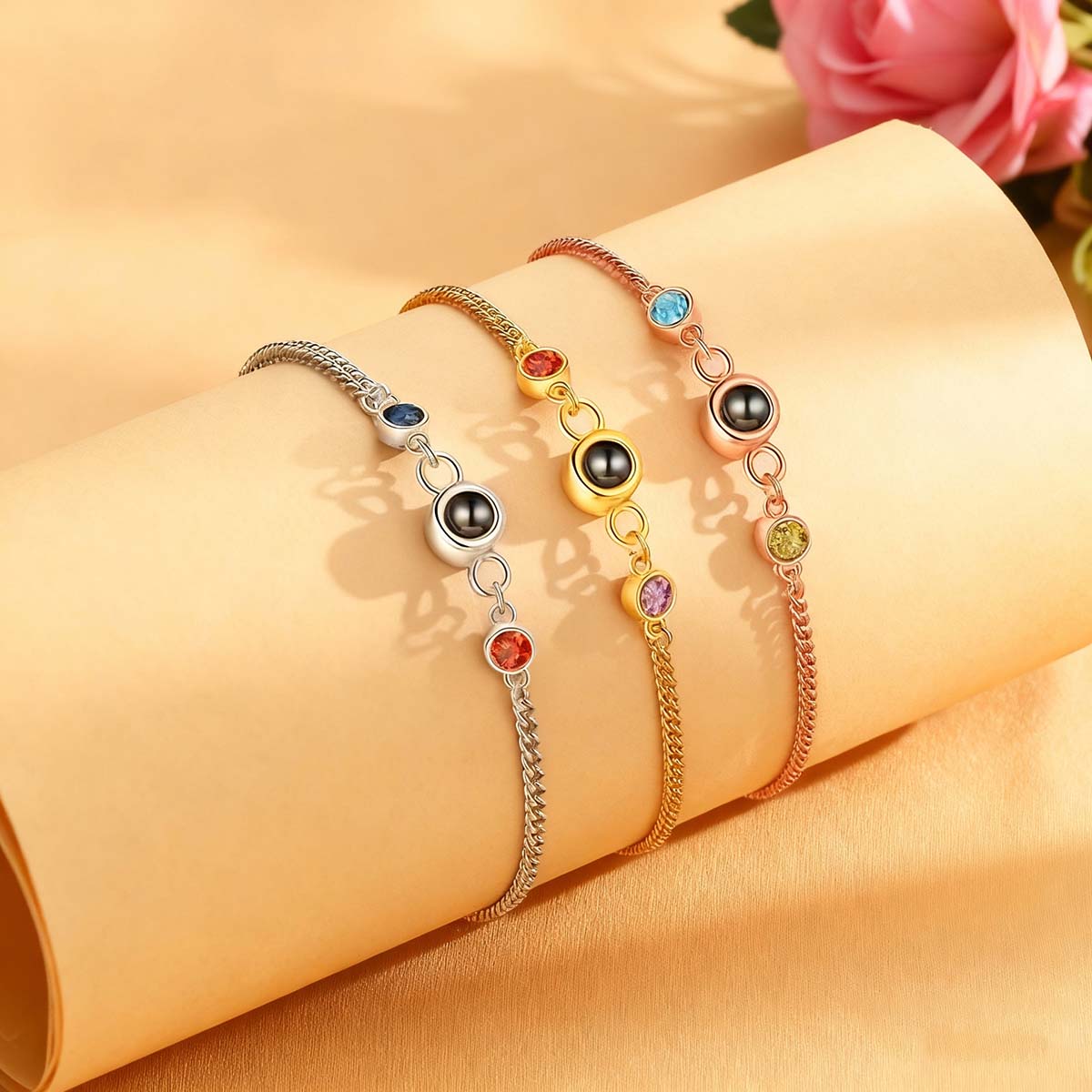 Double birthstone projection bracelets in silver, gold and rose gold, family birthstone jewelry flat lay