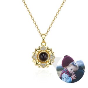 Gold sunflower heart photo projection necklace on white, baby photo projecting from center crystal