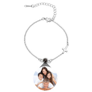 Silver sideways cross projection bracelet on white, family photo projecting from round bead