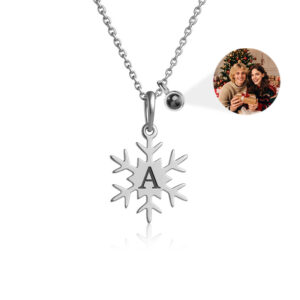 Silver personalized snowflake necklace with custom initial, hidden holiday photo inside projection charm