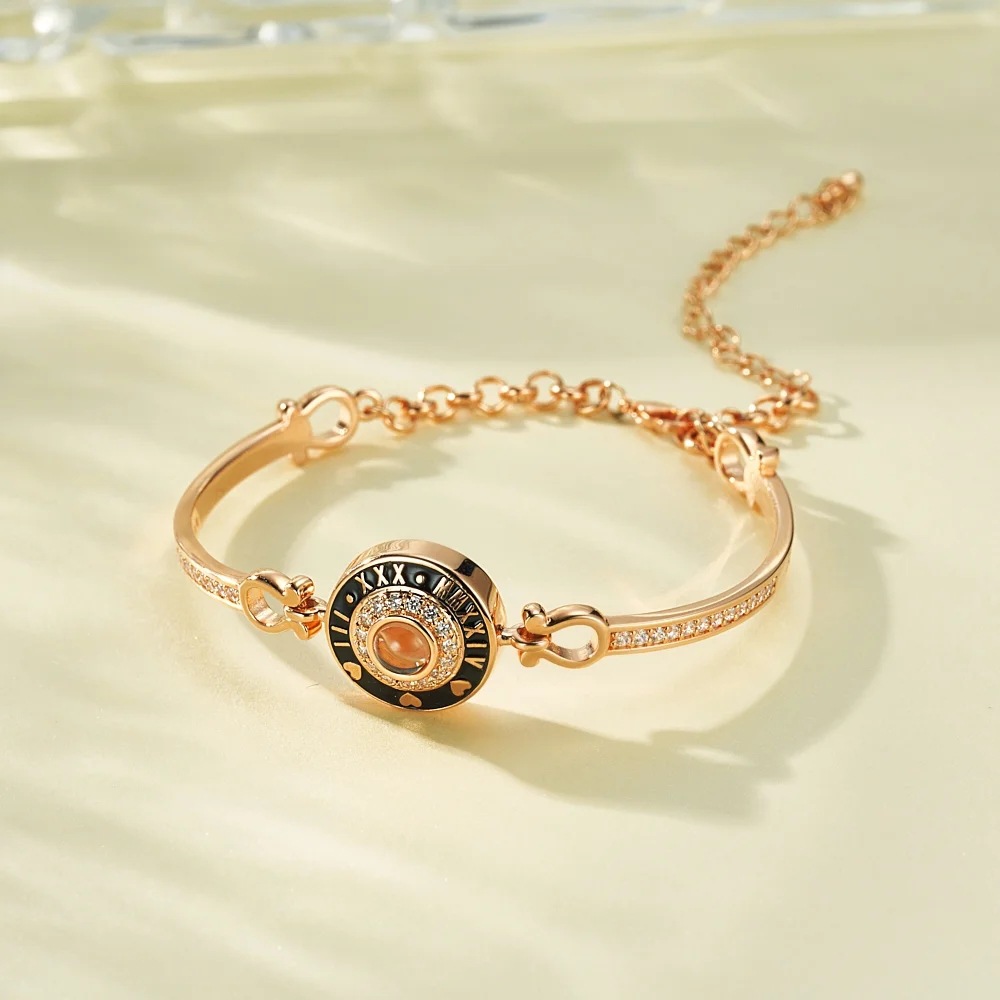 Rose gold Roman numeral photo bangle close up, black enamel clock face with crystal pave