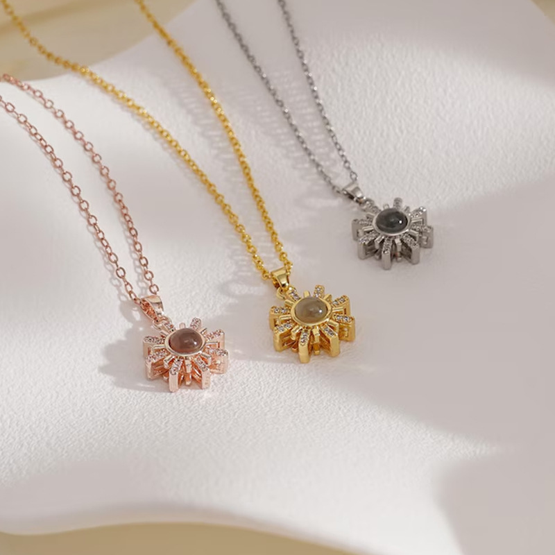Sunshine sun projection necklaces in gold, rose gold and silver, radiant ray pendants flat lay