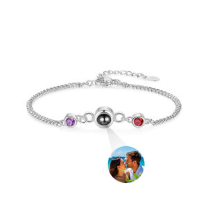 Silver double birthstone photo bracelet on white, couple photo projecting from round crystal