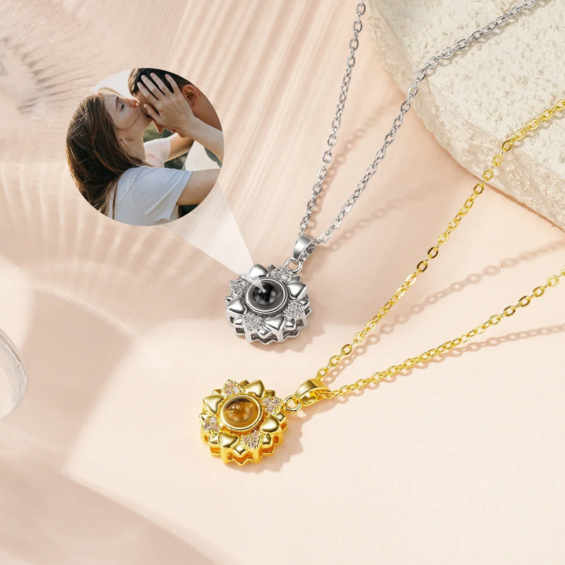 Sunflower heart petals projection necklaces in silver and gold, couple kissing photo projecting from crystal