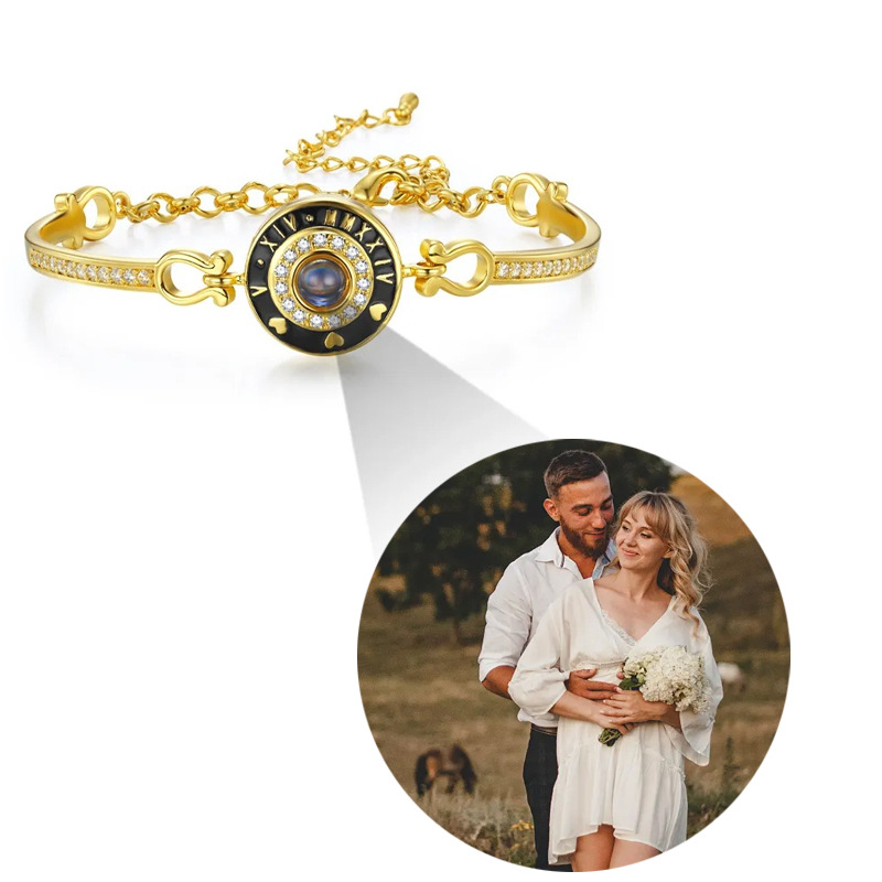 Gold Roman numeral clock projection bangle, couple memory projecting from pave crystal